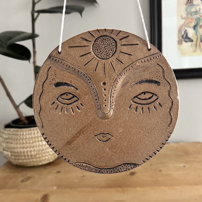 Sun face wall hanging