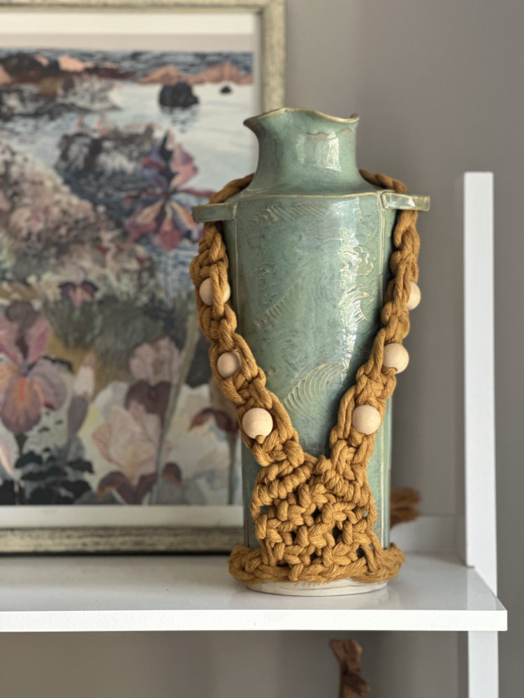 Green ceramic vase with yellow beaded macramé